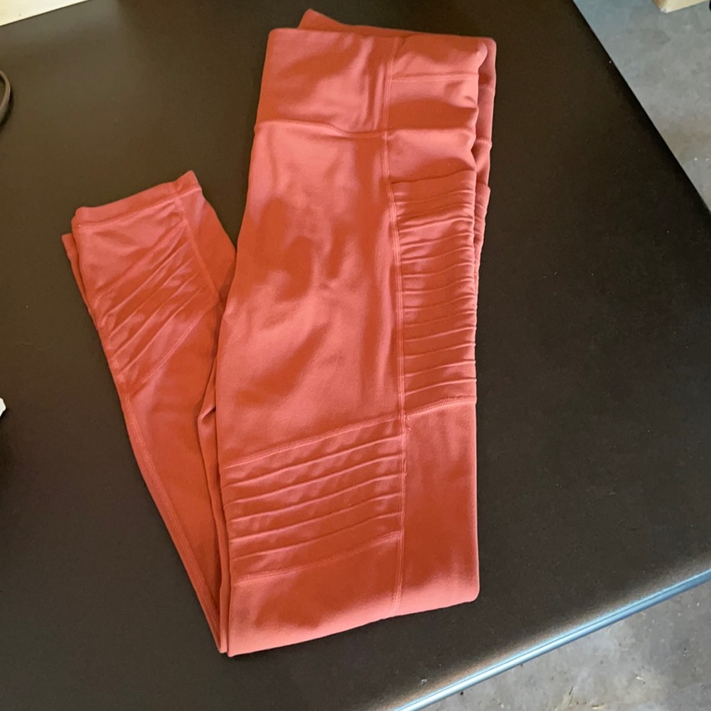 Rust colored moto leggings from Athleta. Size M